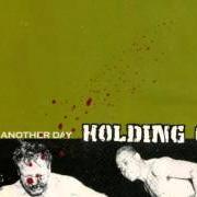 Le texte musical THE JOKE IS ON US de HOLDING ON est également présent dans l'album Just another day (2001)