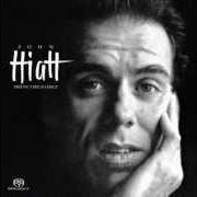 Le texte musical LIPSTICK SUNSET de JOHN HIATT est également présent dans l'album Bring the family (1987)