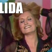 Le texte musical FEMME EST LA NUIT de DALIDA est également présent dans l'album Besame mucho (1976)